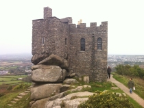Perched on the natural Tor, Carn Brea Castle is a precarious looking building.