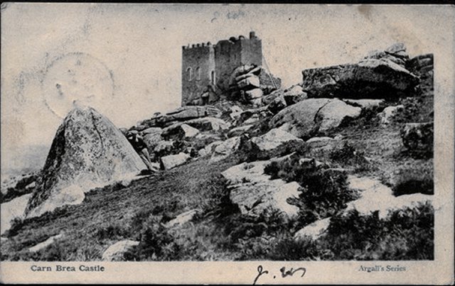 Carn Brea castle as seen in this period postcard.