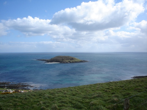 'Looe Island', or 'St. Georges Island' on a wind swept day. Notice the 1930's built housing which forms Hannafore in the bottom left corner.