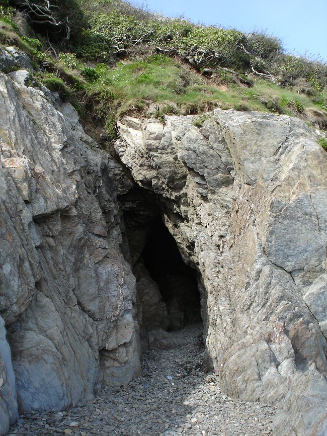 The gash in the cliffside. The tunnel lies beyond.